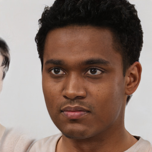 Neutral black young-adult male with short  brown hair and brown eyes