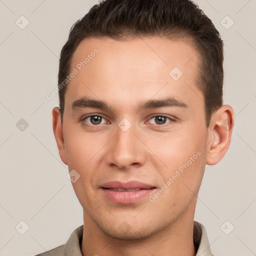 Joyful white young-adult male with short  brown hair and brown eyes