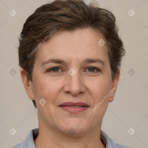 Joyful white adult female with short  brown hair and brown eyes