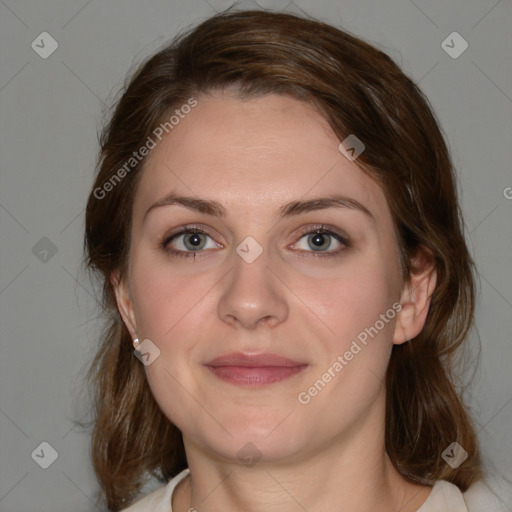 Joyful white young-adult female with medium  brown hair and blue eyes