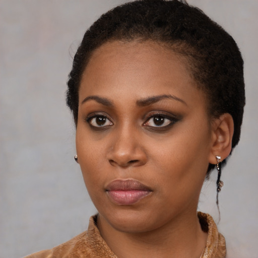 Neutral black young-adult female with medium  black hair and brown eyes
