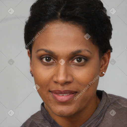 Joyful black adult female with short  brown hair and brown eyes