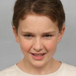 Joyful white child female with short  brown hair and brown eyes