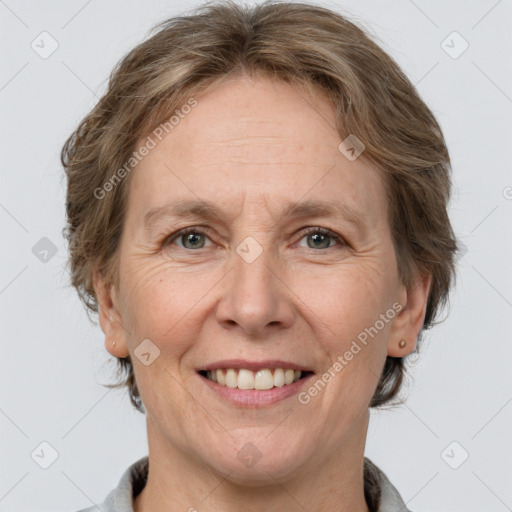 Joyful white adult female with medium  brown hair and grey eyes