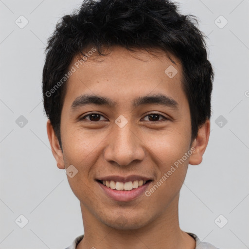 Joyful latino young-adult male with short  black hair and brown eyes