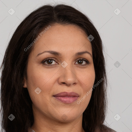 Joyful white adult female with long  brown hair and brown eyes