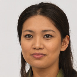 Joyful asian young-adult female with long  brown hair and brown eyes