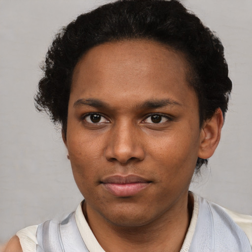 Neutral black young-adult female with short  brown hair and brown eyes