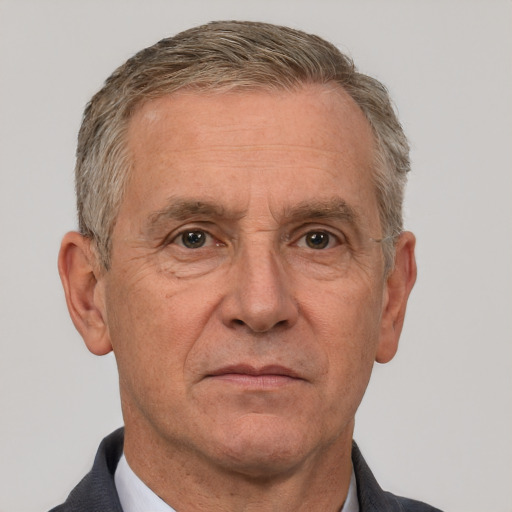 Neutral white middle-aged male with short  gray hair and brown eyes