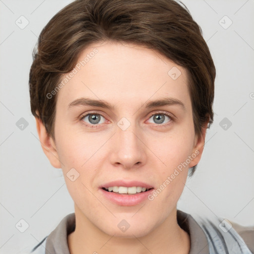 Joyful white young-adult female with short  brown hair and grey eyes