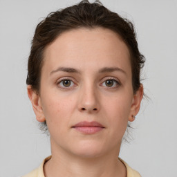 Neutral white young-adult female with short  brown hair and brown eyes