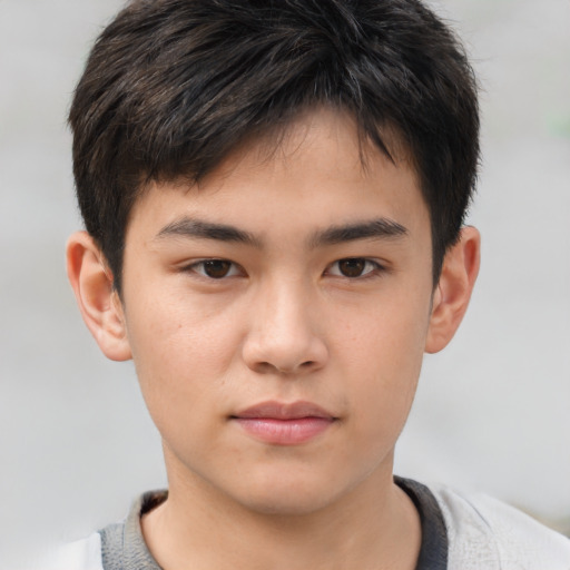 Neutral asian child male with short  brown hair and brown eyes