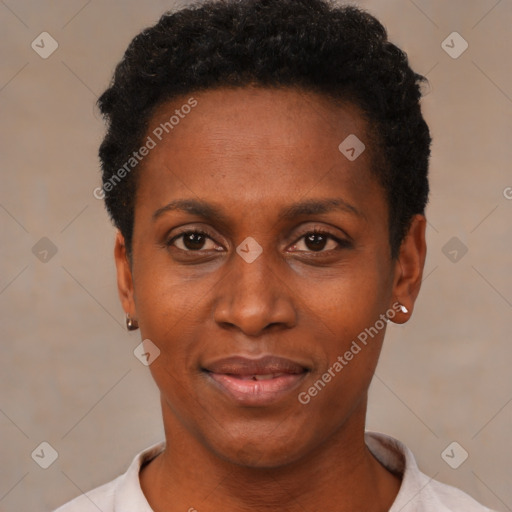 Joyful black young-adult female with short  black hair and brown eyes