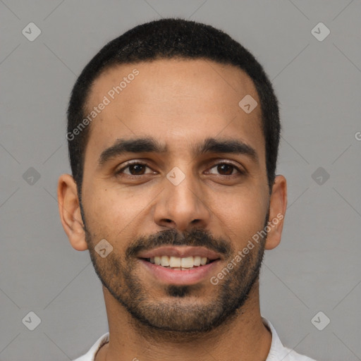 Joyful latino young-adult male with short  black hair and brown eyes