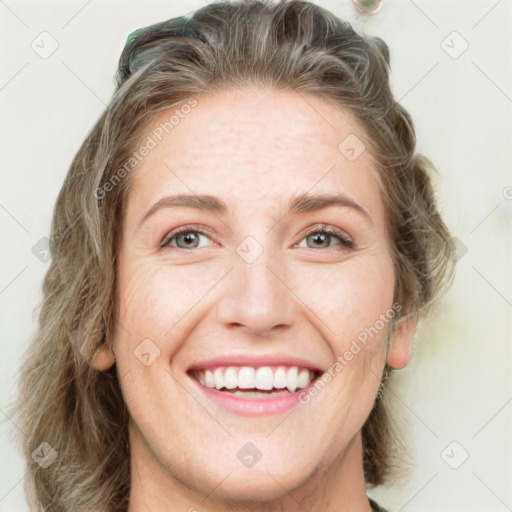 Joyful white young-adult female with long  brown hair and green eyes