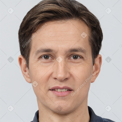 Joyful white adult male with short  brown hair and brown eyes