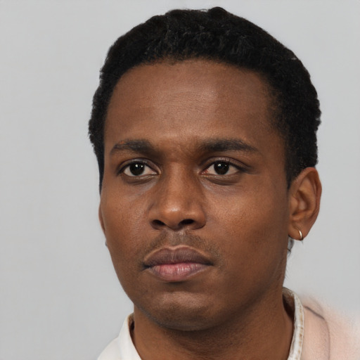 Neutral black young-adult male with short  black hair and brown eyes
