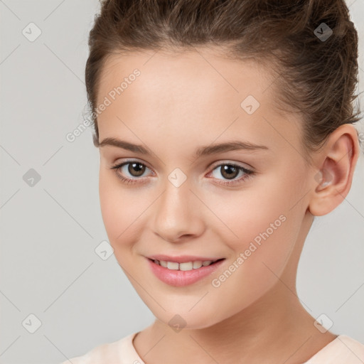 Joyful white child female with short  brown hair and brown eyes