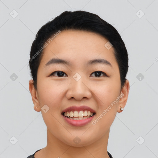 Joyful asian young-adult female with short  black hair and brown eyes