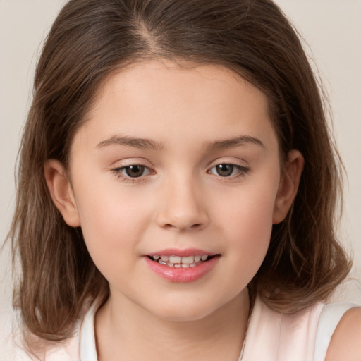 Joyful white child female with medium  brown hair and brown eyes