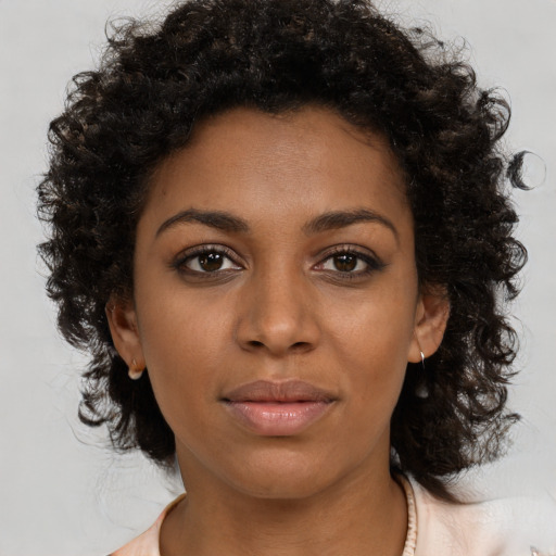 Neutral black young-adult female with medium  brown hair and brown eyes