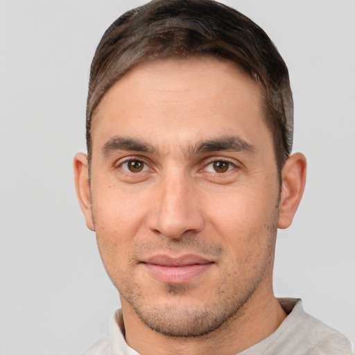 Joyful white young-adult male with short  brown hair and brown eyes