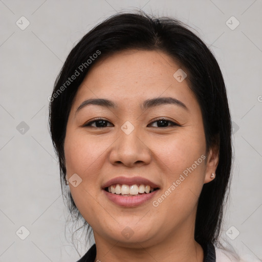 Joyful asian young-adult female with medium  brown hair and brown eyes