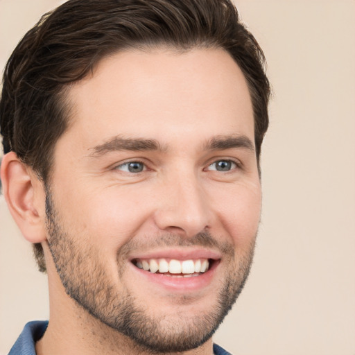 Joyful white young-adult male with short  brown hair and brown eyes