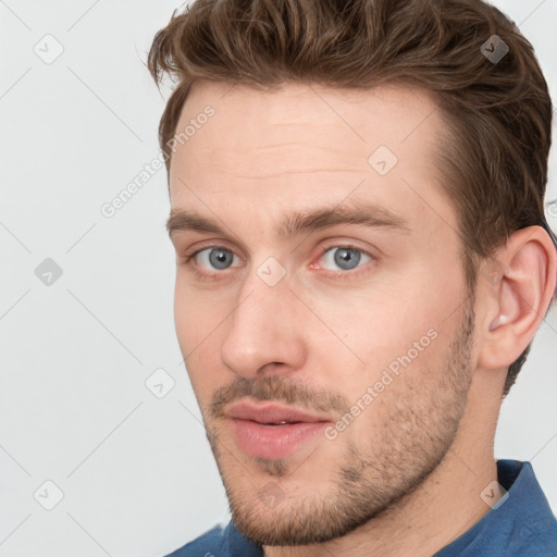 Neutral white young-adult male with short  brown hair and grey eyes