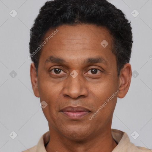 Joyful latino adult male with short  black hair and brown eyes