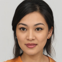 Joyful asian young-adult female with medium  black hair and brown eyes