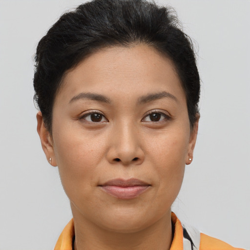 Joyful asian young-adult female with short  brown hair and brown eyes