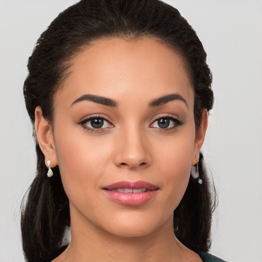 Joyful white young-adult female with long  brown hair and brown eyes