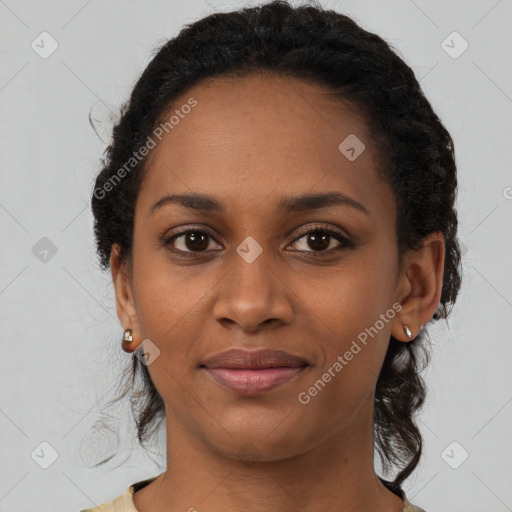 Joyful black young-adult female with short  black hair and brown eyes