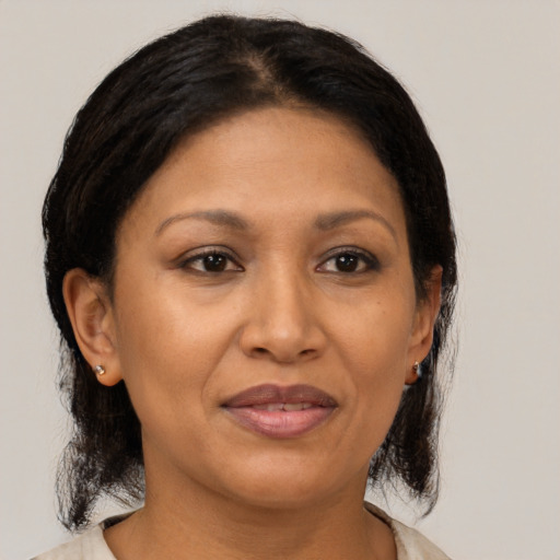 Joyful asian adult female with medium  brown hair and brown eyes