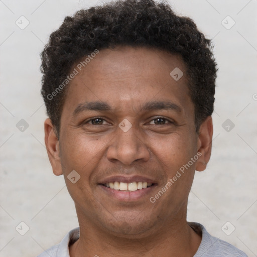 Joyful latino young-adult male with short  brown hair and brown eyes