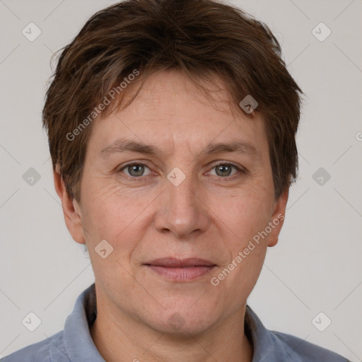 Joyful white adult female with short  brown hair and brown eyes