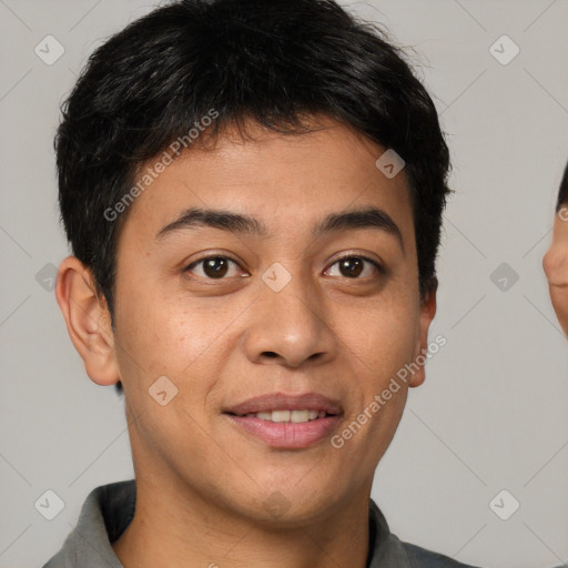 Joyful asian young-adult male with short  brown hair and brown eyes