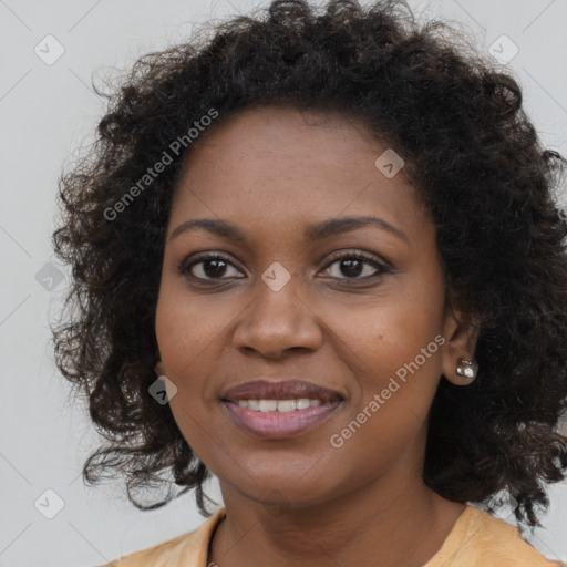 Joyful black young-adult female with long  brown hair and brown eyes