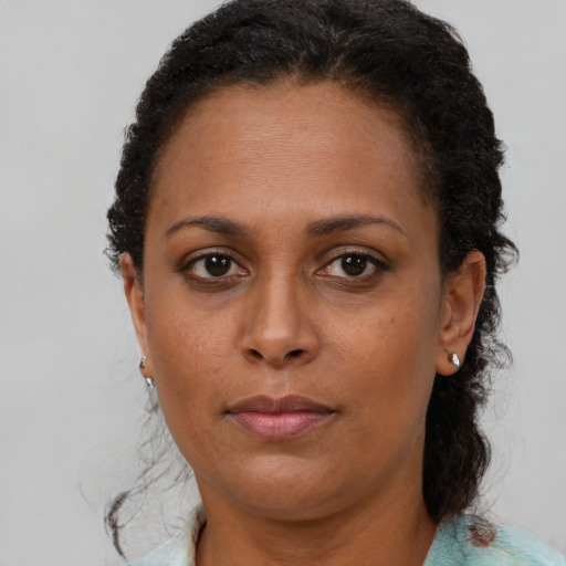 Neutral black adult female with short  brown hair and brown eyes