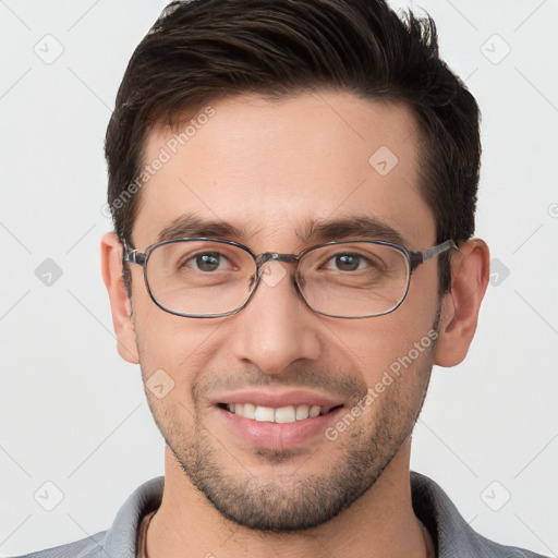 Joyful white young-adult male with short  brown hair and brown eyes