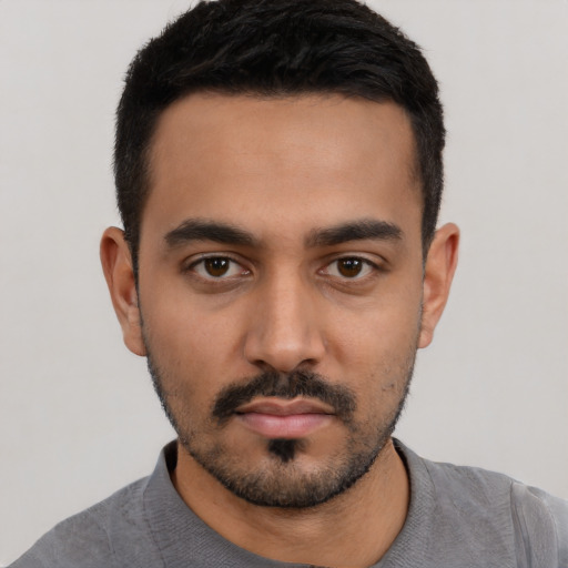 Neutral latino young-adult male with short  black hair and brown eyes