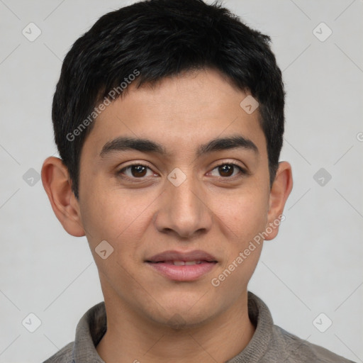 Joyful latino young-adult male with short  black hair and brown eyes