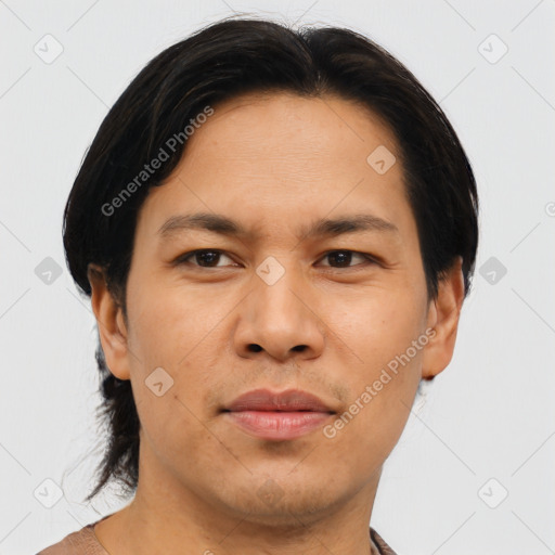 Joyful asian young-adult male with short  brown hair and brown eyes