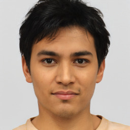 Joyful asian young-adult male with short  black hair and brown eyes