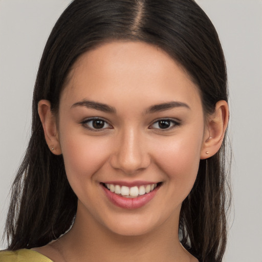 Joyful white young-adult female with long  brown hair and brown eyes