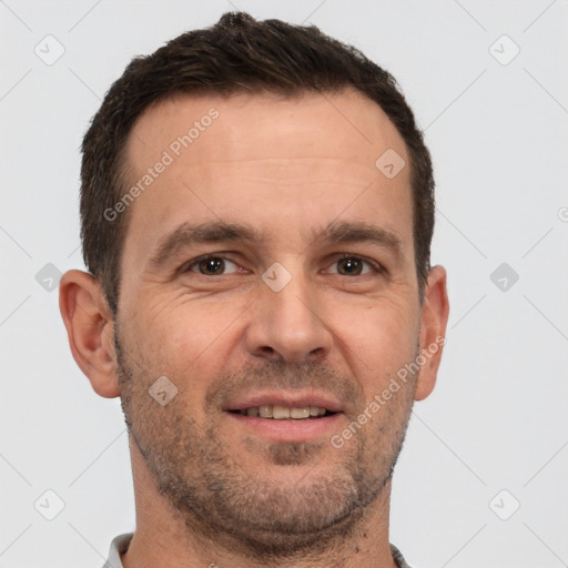 Joyful white adult male with short  brown hair and brown eyes