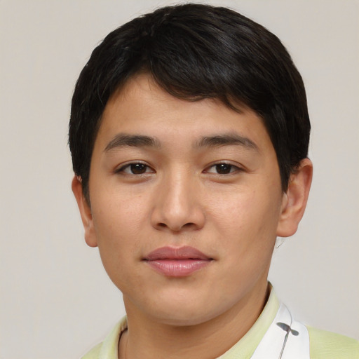 Joyful asian young-adult male with short  brown hair and brown eyes