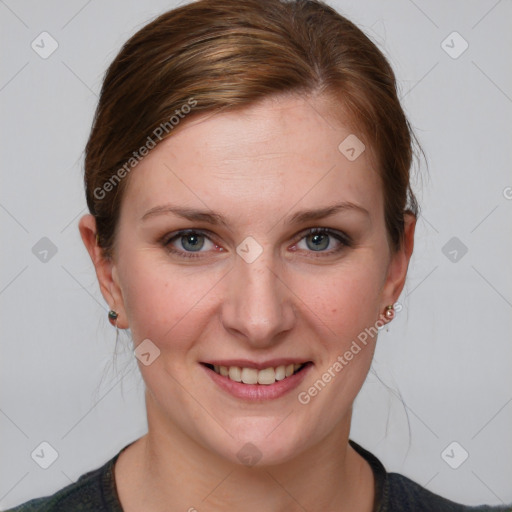 Joyful white young-adult female with medium  brown hair and blue eyes