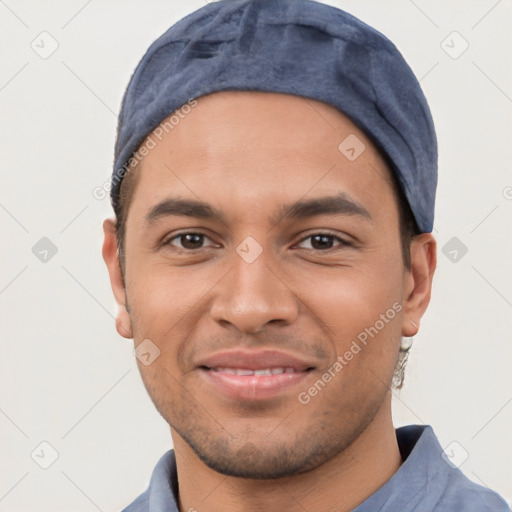 Joyful white young-adult male with short  black hair and brown eyes